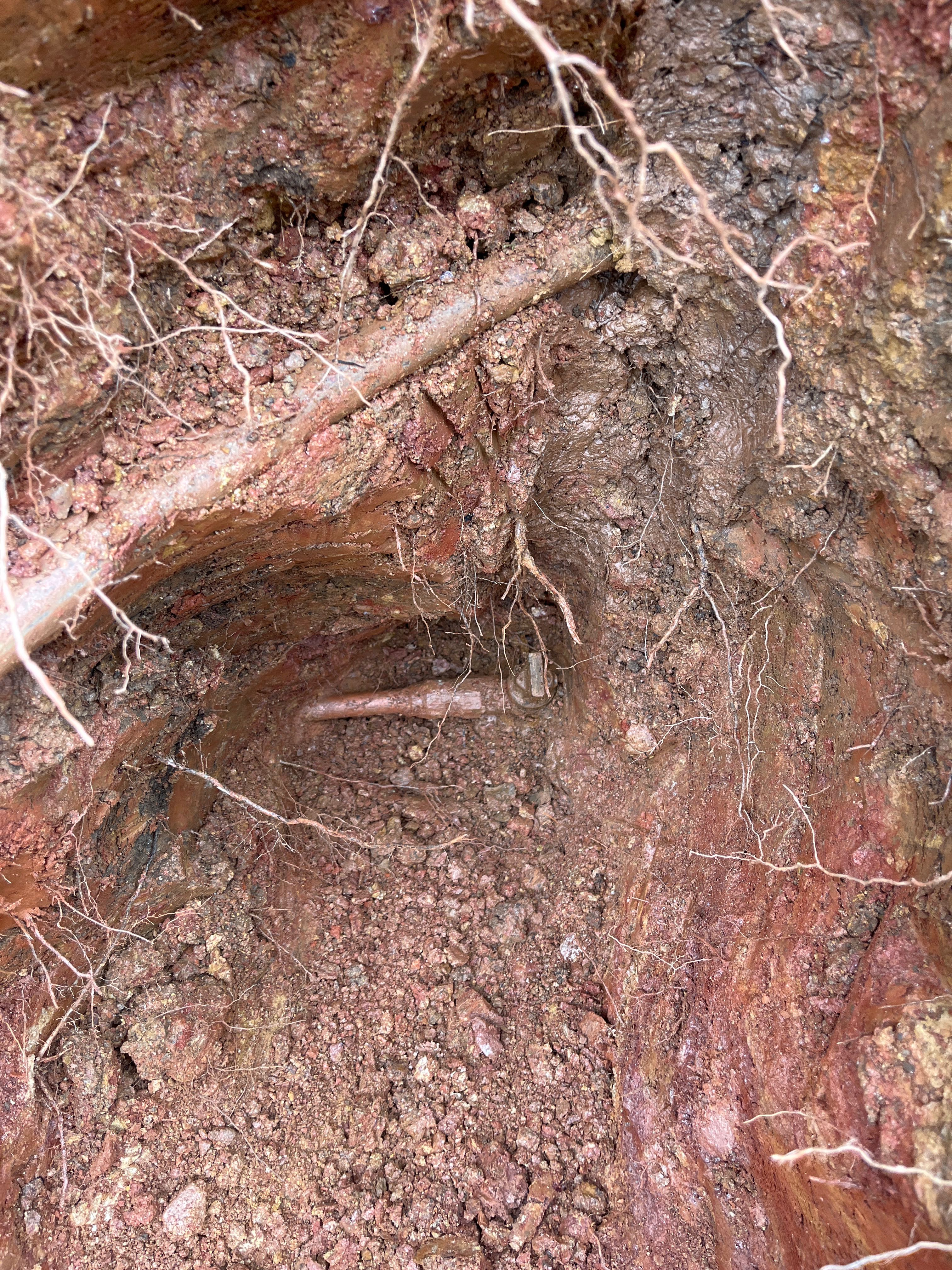 Damaged collapsed sewer pipe before trenchless repair